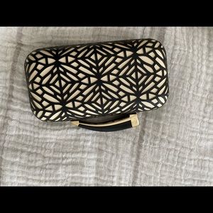 Vince clutch laser cut print. Black & white. NWOT
